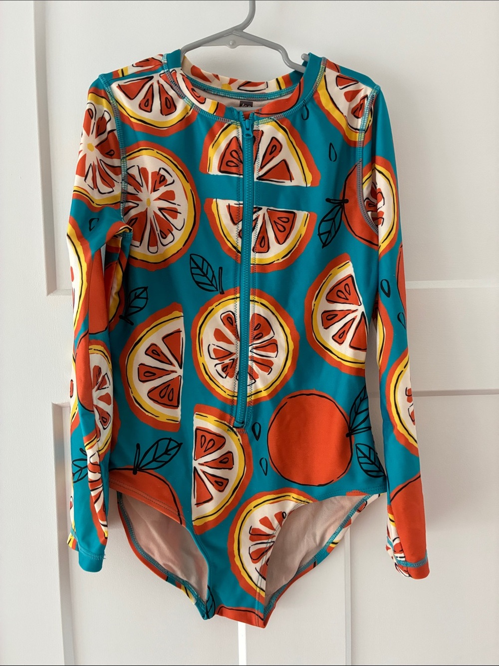 Tea Collection Kids Long-Sleeve Rashguard Swimsuit in Teal & Orange Citrus